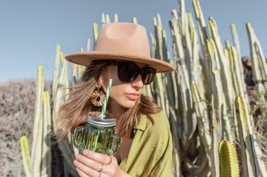 Fashion portrait of a woman on a desert landscape