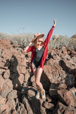 Fashion portrait of a woman on a desert landscape