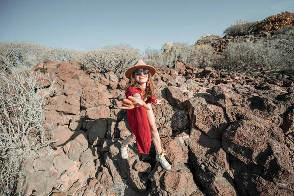 Woman on a desert rocky landscape — 스톡 사진