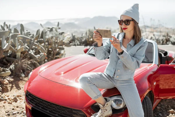 Woman traveling by sports car on the island — Stockfoto