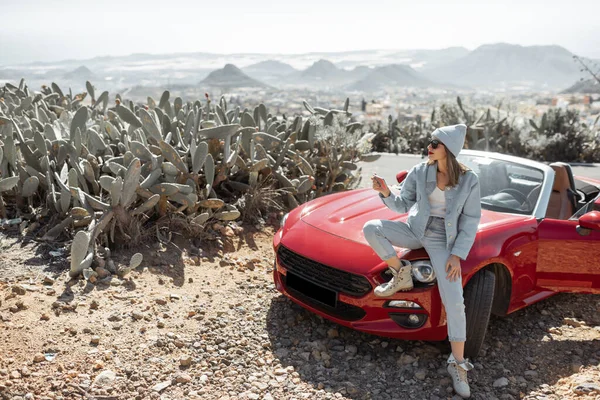 Woman traveling by sports car on the island — 图库照片