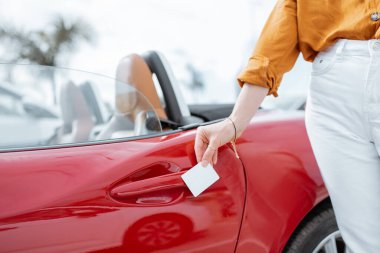 Opening car door with a plastic card