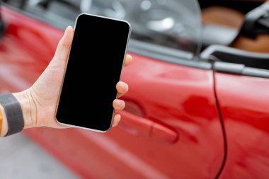 Holding smartphone near the car door