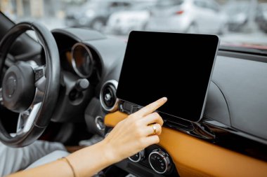 Woman touching digital dashboard