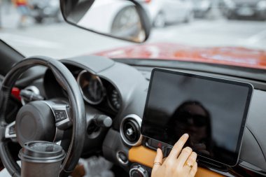 Woman touching digital dashboard