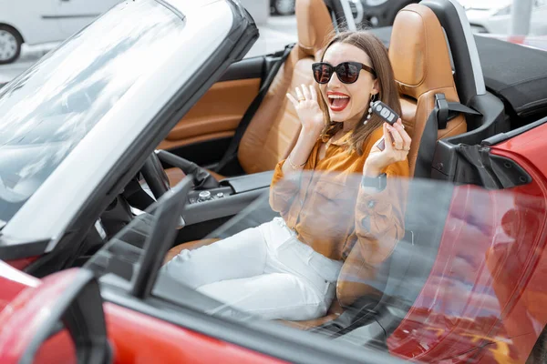 Portrait of a happy woman in the car — Stock Fotó