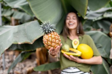 Woman with exotic food outdoors