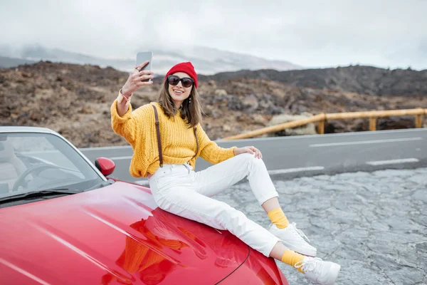 Carefree woman traveling by car — Stock Fotó