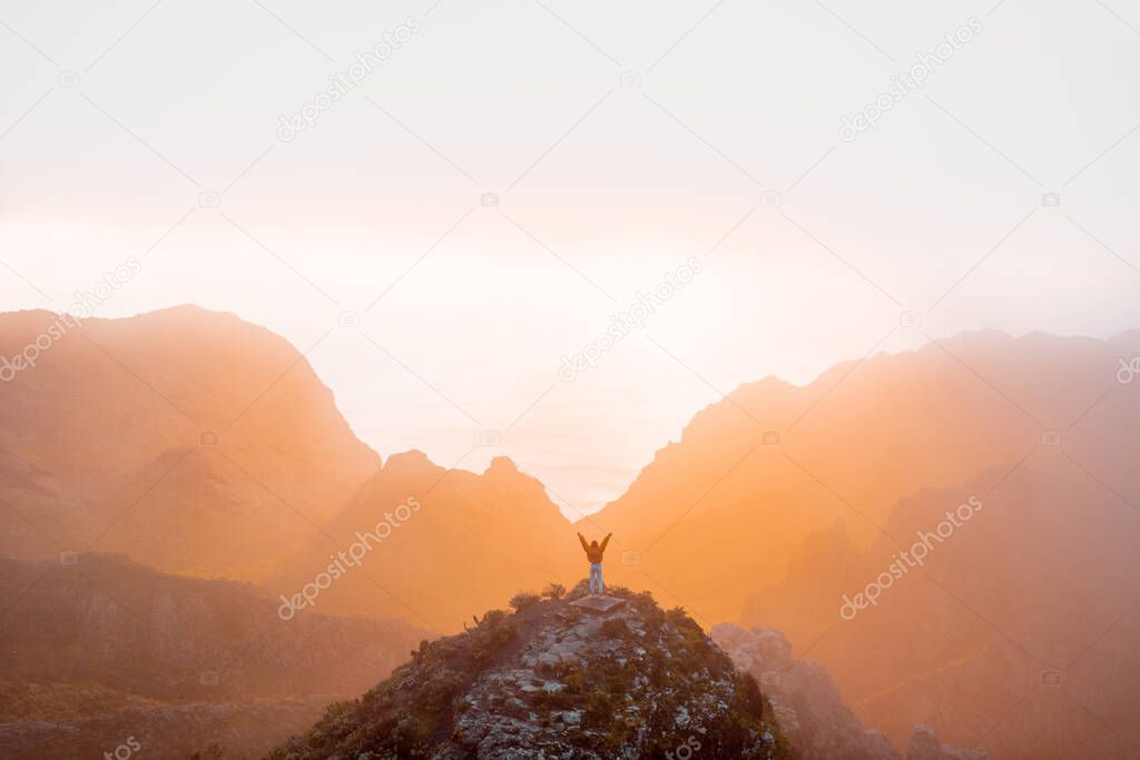 Mountain range under the clouds on a sunset