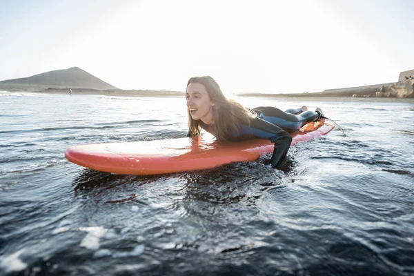 Woman swimming on the surfboard — Stock Photo, Image