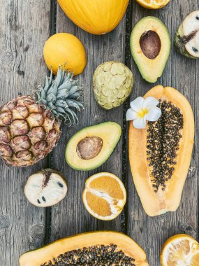 Top view on the wooden table full of exotic fruits and berries