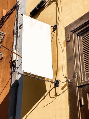 Board with empty space on the old building facade