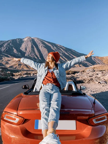 Woman traveling by car on the volcanic valley — Stock Photo, Image