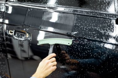 Preparing vehicle body before protective film apply