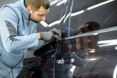 Filming car body at the vehicle service