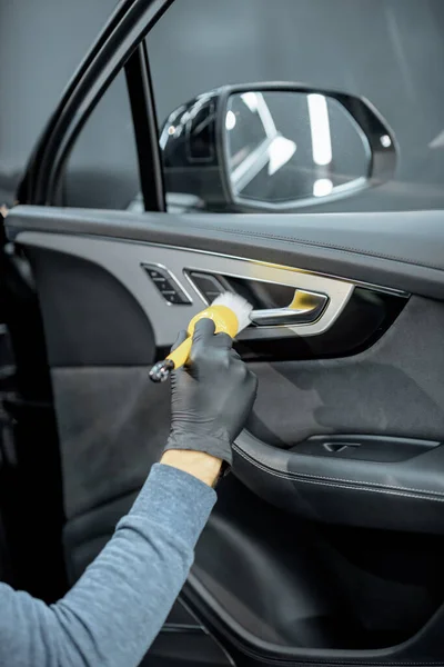 Worker provides professional car interior cleaning — Stock Fotó