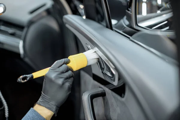 Worker provides professional car interior cleaning — Stock Fotó