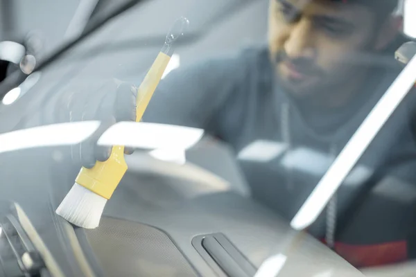 Worker provides professional car interior cleaning — Stock Fotó