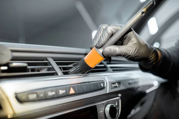 Worker provides professional car interior cleaning — Stock Fotó