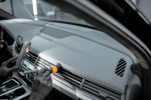 Worker provides professional car interior cleaning — Stock Fotó