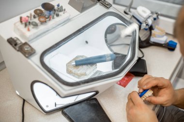 Dental technician working at the laboratory