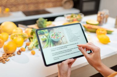 Cooking food using recipe on a digital tablet