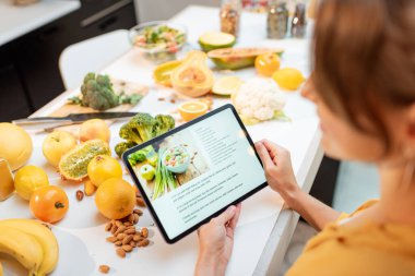 Cooking food using recipe on a digital tablet