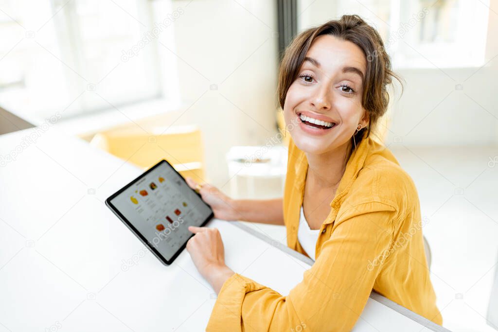 Woman with digital tablet at home