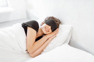 Woman sleeping with sleeping mask