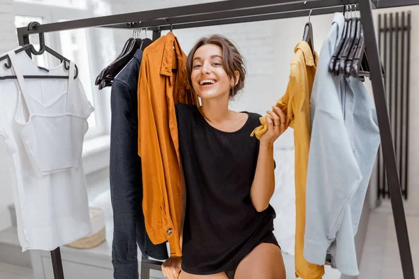 Portrait of a young woman in the wardrobe — Stock Photo, Image