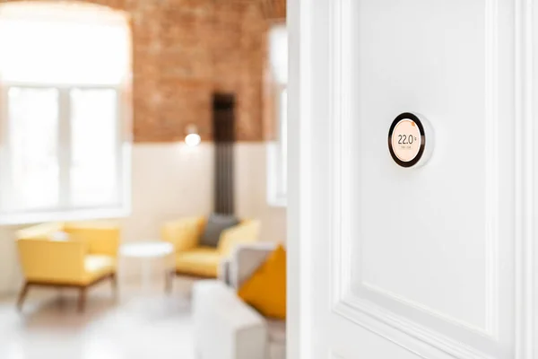 Thermostat with touch screen installed on the wall indoors — Stock Photo, Image