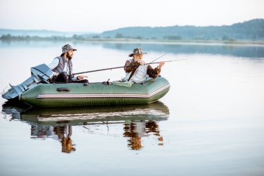 Grandfather with son fishing on the boat