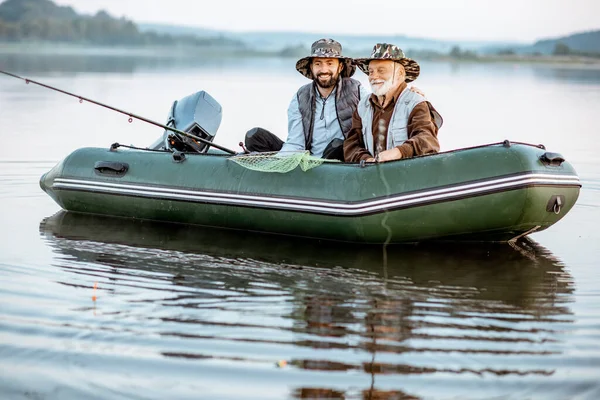 Grandfather with son fishing on the boat — Φωτογραφία Αρχείου