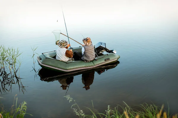 Grandfather with son fishing on the boat — 图库照片