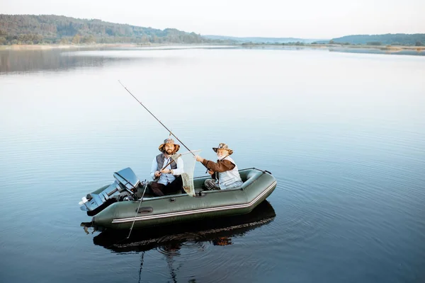 Grandfather with son fishing on the boat — Φωτογραφία Αρχείου