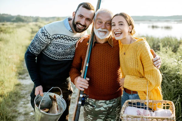 Grandfather with son and daughter outdoors — 图库照片