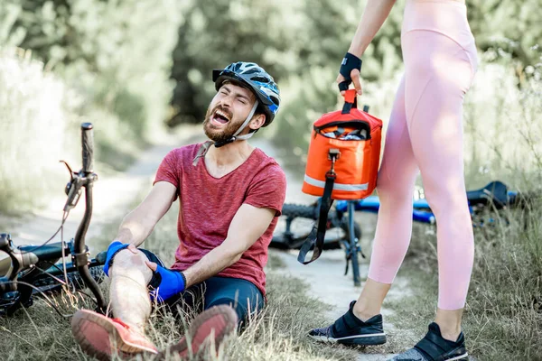 Man having injury while cycling outdoors — Stock Fotó