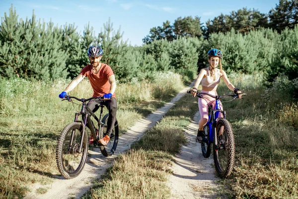 Cyclists riding mountain bicycles outdoors