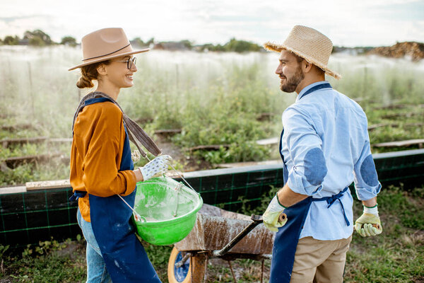 Workers on the farmland for growing snails