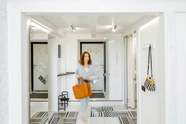 Apartment hallway with blurred human figure