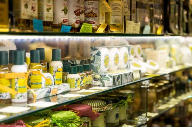 FLORENCE, ITALY - 25, MARCH, 2016: Horizontal picture of delicious Italian products at Mercato Centrale Firenze, a touristic destionation of Florence, Italy clipart