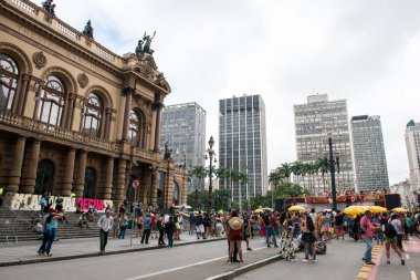 SAO PAULO, BRAZIL - 01 MARCH, 2020: Horizontal picture of showing movement of people dancing during carnaval in the streets of Sao Paulo, a popular brazilian traditional party.