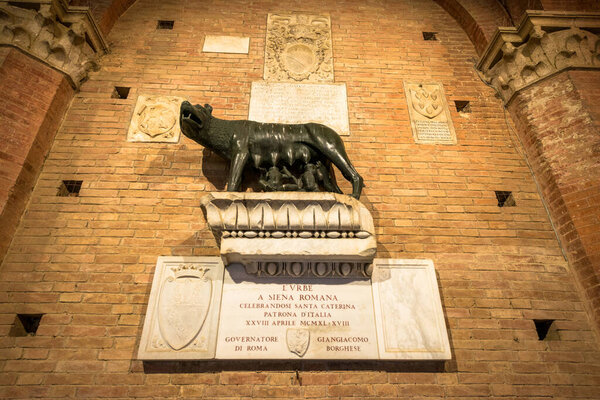 SIENA, ITALY - 13, March, 2018: Horizontal picture of wolf statue inside Torre del Mangia in Siena, Italy
