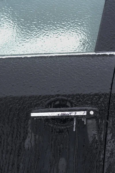 Ice grip of the car door — стоковое фото