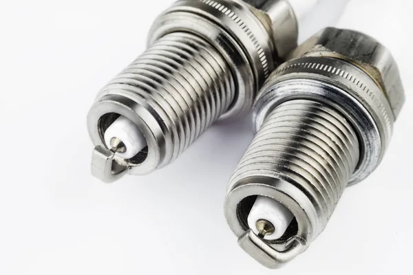 Spark plugs on a light background — Stock Photo, Image