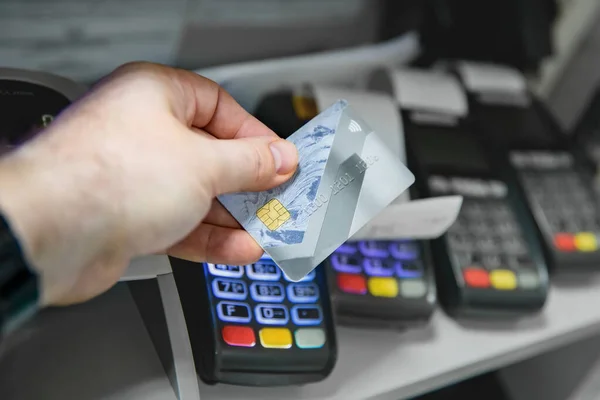 Plastic card in hand with shallow depth of field — Stock Photo, Image