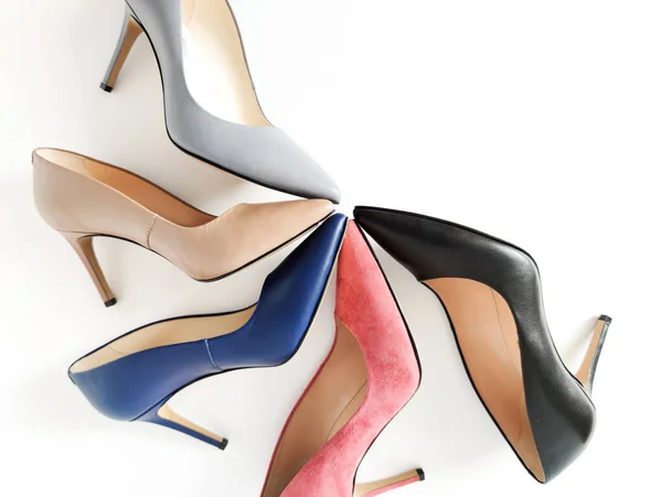 High heels. Top view of several high heels arranged. Black, blue, beige, gray, coral high heels. Fashion concept, online store. — Stock Photo, Image