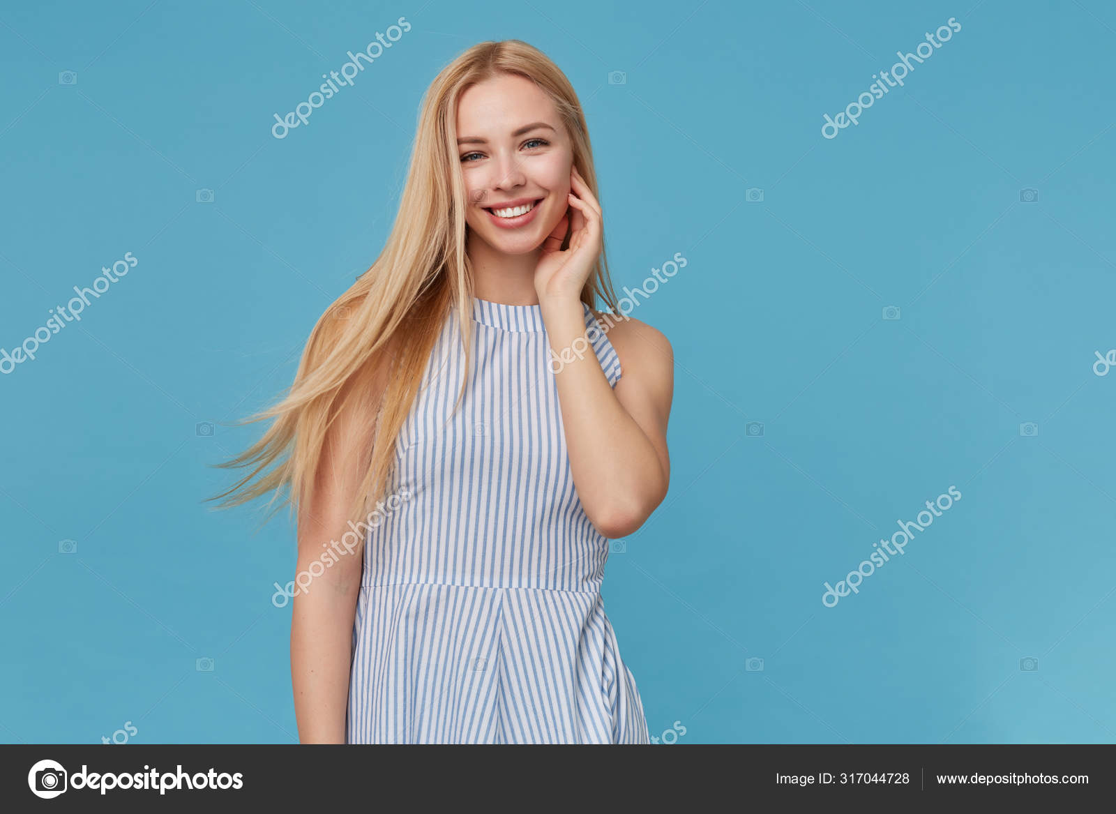 Woman tucking hair behind ear