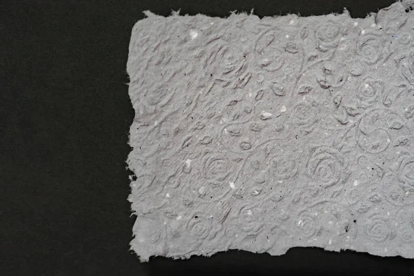 Handmade paper. A stack of texture paper. Concept of recycling used paper, ecology theme.