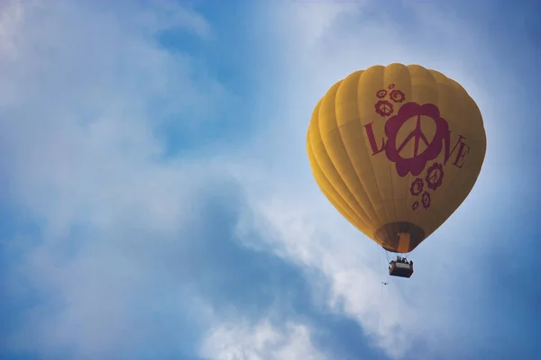 Hot air balloon with love symbol flying